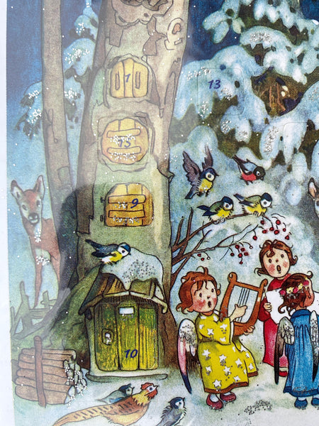 Julkalender med glitter, nostalgi. Hus i skogen