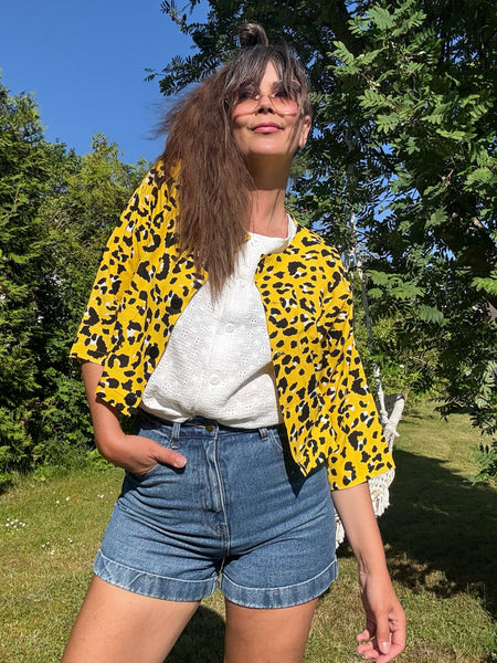 Ärmlös blus i vit brodyr