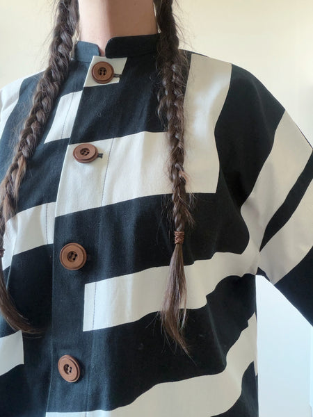 Kappa i återbrukad bomull, svartvit. Stl M