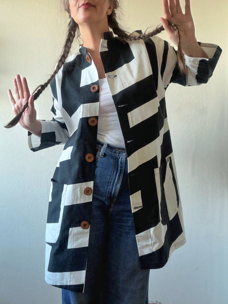 Kappa i återbrukad bomull, svartvit. Stl M