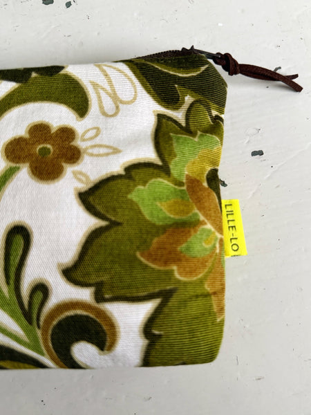 Necessär med gröna medaljonger