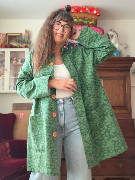 Kappa i återbrukad bomull, grön. Stl L