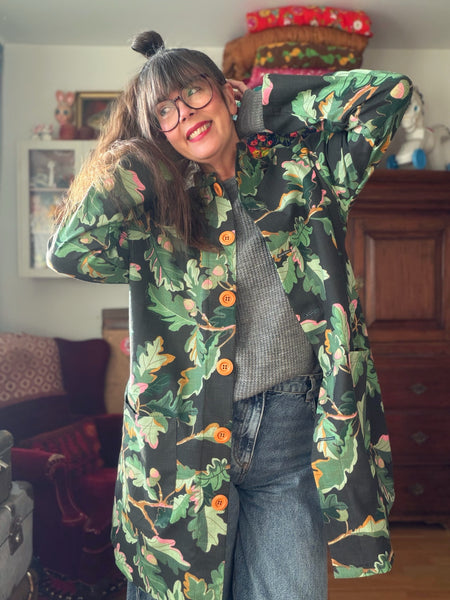 Kappa i återbrukad bomull, eklöv. Stl M