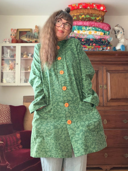 Kappa i återbrukad bomull, grön. Stl L