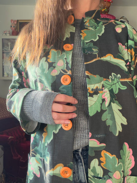 Kappa i återbrukad bomull, eklöv. Stl M