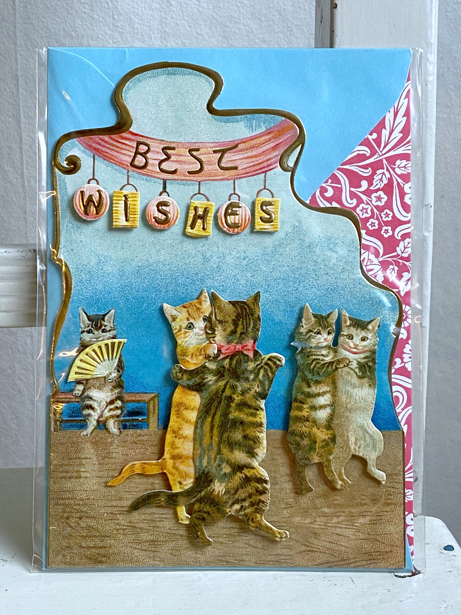 Dubbelt utskuret kort med dansande katter