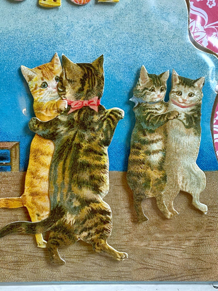 Dubbelt utskuret kort med dansande katter